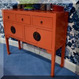 F20. Orange Asian-inspired laquer sideboard. 42”h x 52”w x 28”d 